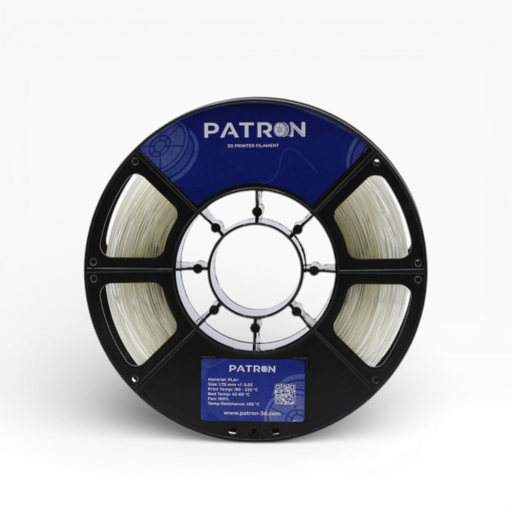 Clear PLA+ filament spool from Patron 3D Filaments, showing the transparent, glossy plastic material for 3D printing.